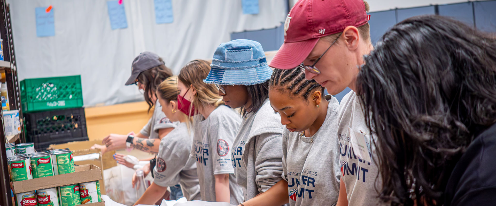 Group of people working at a food distribution center.